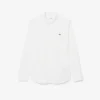Camicia in popeline elasticizzato dalla vestibilità regolare Camicia in popeline elasticizzato dalla vestibilità regolare