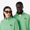 Felpa unisex dalla vestibilità ampia con mezzo zip e badge Felpa unisex dalla vestibilità ampia con mezzo zip e badge