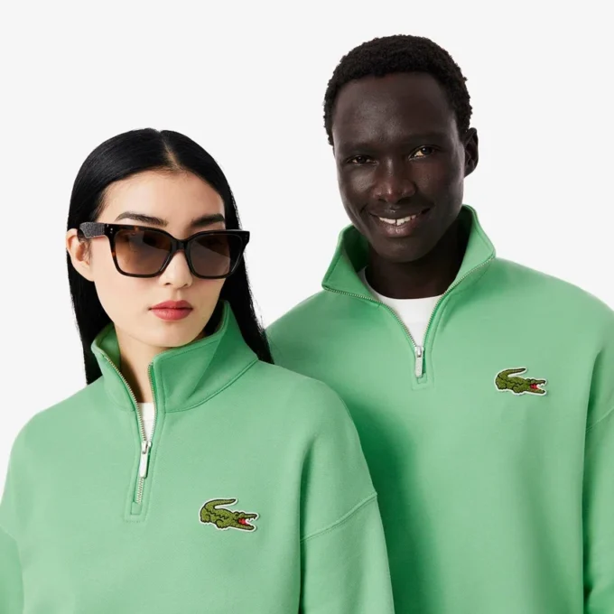 Felpa unisex dalla vestibilità ampia con mezzo zip e badge Felpa unisex dalla vestibilità ampia con mezzo zip e badge