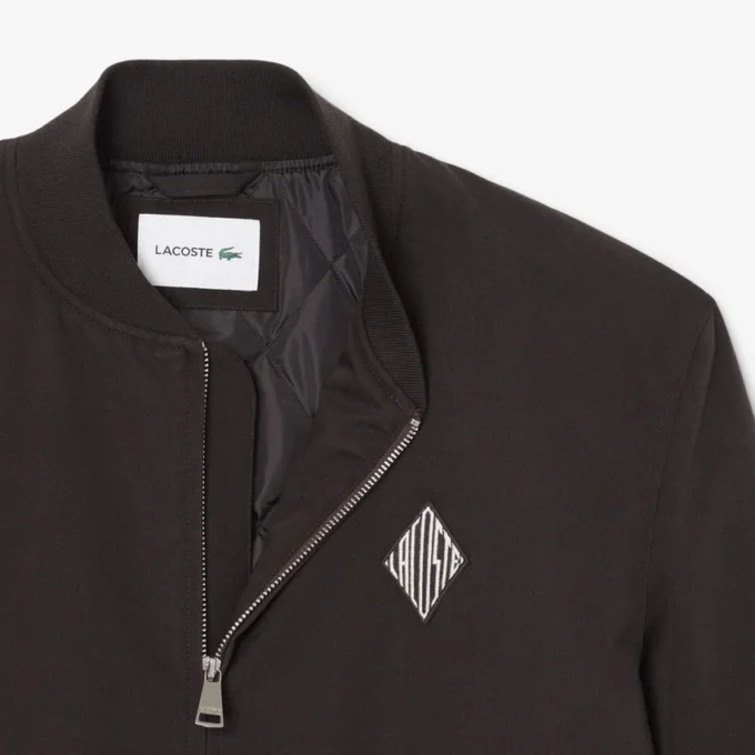 Giacca bomber idrorepellente con badge retrò Giacca bomber idrorepellente con badge retrò
