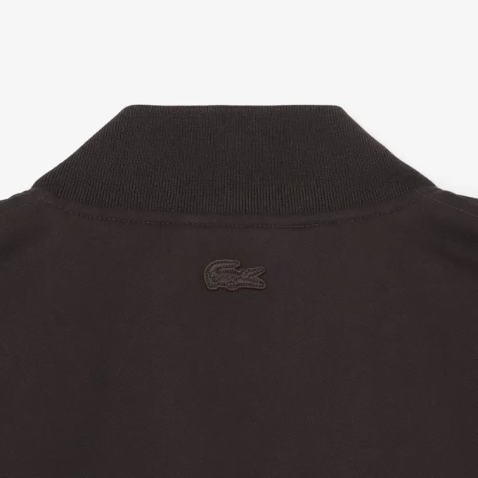 Giacca bomber idrorepellente con badge retrò Giacca bomber idrorepellente con badge retrò