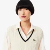 Gilet da donna in maglia a trecce di lana Gilet da donna in maglia a trecce di lana
