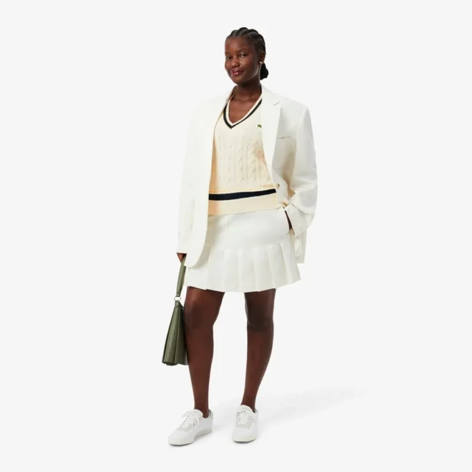 Gilet da donna in maglia a trecce di lana Gilet da donna in maglia a trecce di lana