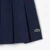 Gonna corta a pieghe in cotone elasticizzato da donna Gonna corta a pieghe in cotone elasticizzato da donna
