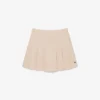Gonna corta a pieghe in cotone elasticizzato da donna Gonna corta a pieghe in cotone elasticizzato da donna