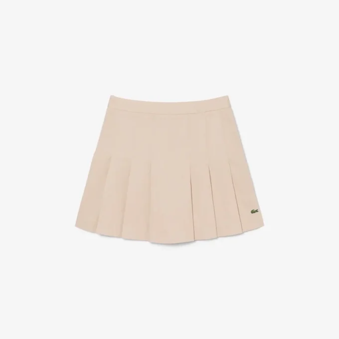 Gonna corta a pieghe in cotone elasticizzato da donna Gonna corta a pieghe in cotone elasticizzato da donna