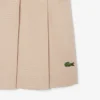 Gonna corta a pieghe in cotone elasticizzato da donna Gonna corta a pieghe in cotone elasticizzato da donna