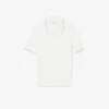 Maglione a righe con collo a polo e lavorazione a trecce Maglione a righe con collo a polo e lavorazione a trecce