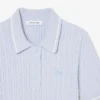 Maglione a righe con collo a polo e lavorazione a trecce Maglione a righe con collo a polo e lavorazione a trecce