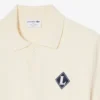 Maglione con colletto Polo e badge “Made in France” Maglione con colletto Polo e badge “Made in France”