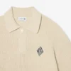 Maglione con collo a polo a coste perlate e dettaglio badge Maglione con collo a polo a coste perlate e dettaglio badge