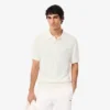 Maglione da uomo in maglia a costine fluida con collo a polo Maglione da uomo in maglia a costine fluida con collo a polo