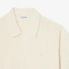Maglione fluido a costine con collo a polo Maglione fluido a costine con collo a polo