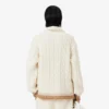 Maglione in lana con collo polo e lavorazione a trecce Maglione in lana con collo polo e lavorazione a trecce