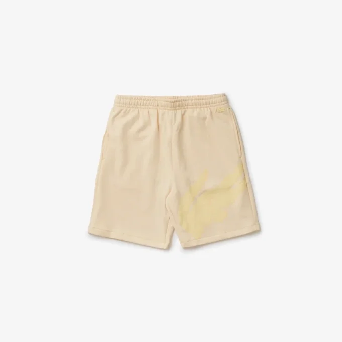 Pantaloncini da uomo oversize in felpa di cotone biologico con stampa coccodrillo Pantaloncini da uomo oversize in felpa di cotone biologico con stampa coccodrillo