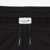 Pantaloncini in pile con striscia logo e vestibilità regolare Pantaloncini in pile con striscia logo e vestibilità regolare
