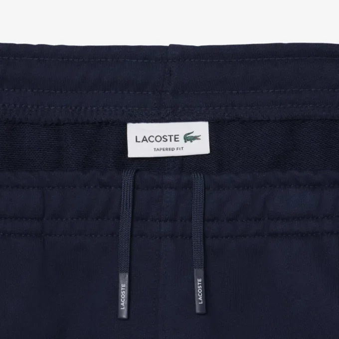 Pantaloni da tuta con striscia e logo Pantaloni da tuta con striscia e logo