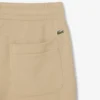 Pantaloni in pile da donna con logo in rilievo Pantaloni in pile da donna con logo in rilievo