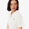 Polo da donna in piqué dalla vestibilità comoda Polo da donna in piqué dalla vestibilità comoda