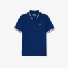 Polo da tennis da donna con colletto a righe e protezione UV Polo da tennis da donna con colletto a righe e protezione UV