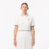 Polo da tennis da donna con colletto a righe e protezione UV Polo da tennis da donna con colletto a righe e protezione UV