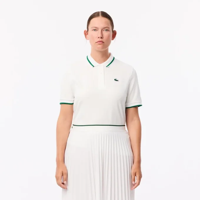Polo da tennis da donna con colletto a righe e protezione UV Polo da tennis da donna con colletto a righe e protezione UV