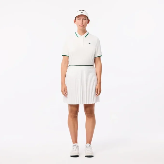 Polo da tennis da donna con colletto a righe e protezione UV Polo da tennis da donna con colletto a righe e protezione UV