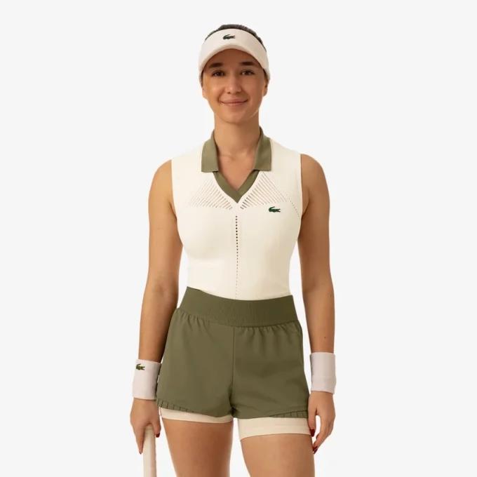 Polo da tennis da donna senza maniche in maglia elasticizzata Polo da tennis da donna senza maniche in maglia elasticizzata