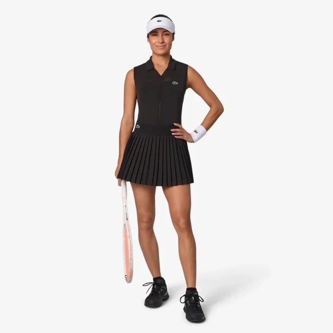 Polo da tennis da donna senza maniche in maglia elasticizzata Polo da tennis da donna senza maniche in maglia elasticizzata