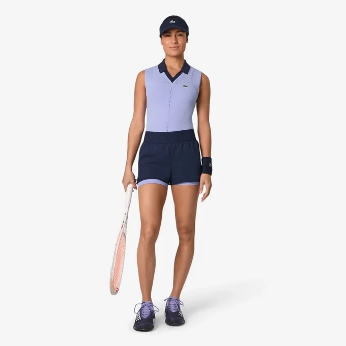Polo da tennis da donna senza maniche in maglia elasticizzata Polo da tennis da donna senza maniche in maglia elasticizzata