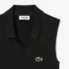 Polo da tennis da donna senza maniche in maglia elasticizzata Polo da tennis da donna senza maniche in maglia elasticizzata