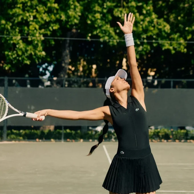 Polo da tennis da donna senza maniche in maglia elasticizzata Polo da tennis da donna senza maniche in maglia elasticizzata