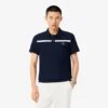 Polo da tennis Heritage da uomo con badge Ultra Dry Polo da tennis Heritage da uomo con badge Ultra Dry
