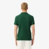 Polo da tennis Heritage da uomo con badge Ultra Dry Polo da tennis Heritage da uomo con badge Ultra Dry