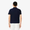 Polo da tennis Heritage da uomo con badge Ultra Dry Polo da tennis Heritage da uomo con badge Ultra Dry