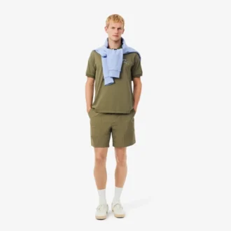 Polo da uomo in piqué con motivo ricamato e vestibilità classica Polo da uomo in piqué con motivo ricamato e vestibilità classica