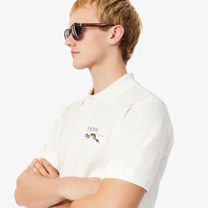 Polo da uomo in piqué con motivo ricamato e vestibilità classica Polo da uomo in piqué con motivo ricamato e vestibilità classica