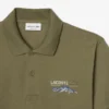 Polo da uomo in piqué con motivo ricamato e vestibilità classica Polo da uomo in piqué con motivo ricamato e vestibilità classica