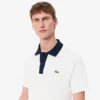 Polo da uomo L.12.12 con collo a contrasto e vestibilità classica Polo da uomo L.12.12 con collo a contrasto e vestibilità classica