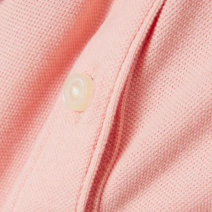 Polo in piqué con collo smerlato da bambina Polo in piqué con collo smerlato da bambina