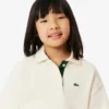Polo oversize in piqué da bambina