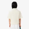 Polo oversize in piqué da bambina