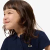 Polo Piqua con collo smerlato da bambina Polo Piqua con collo smerlato da bambina
