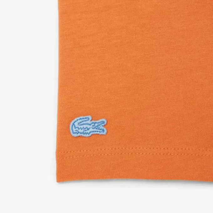 T-shirt in cotone con badge T-shirt in cotone con badge