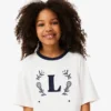 T-shirt in cotone con badge a contrasto T-shirt in cotone con badge a contrasto