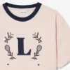 T-shirt in cotone con badge a contrasto T-shirt in cotone con badge a contrasto