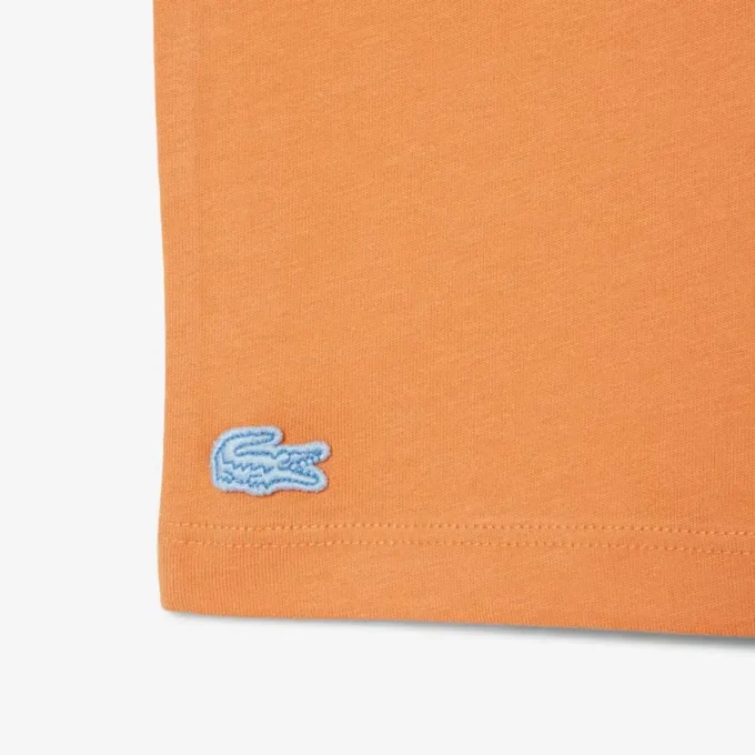 T-shirt in cotone con dettaglio badge T-shirt in cotone con dettaglio badge