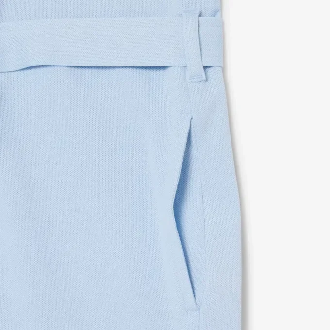 Tuta con colletto polo in piqué elasticizzato Tuta con colletto polo in piqué elasticizzato