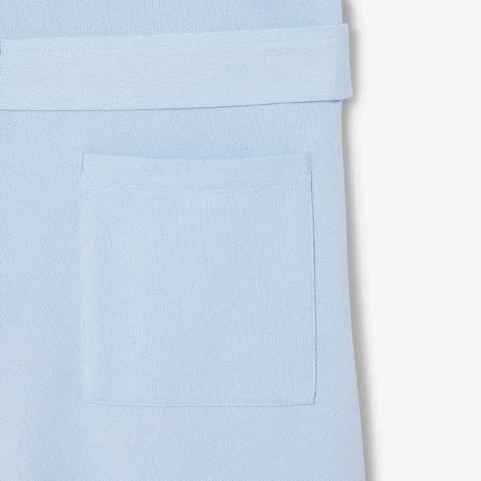 Tuta con colletto polo in piqué elasticizzato Tuta con colletto polo in piqué elasticizzato