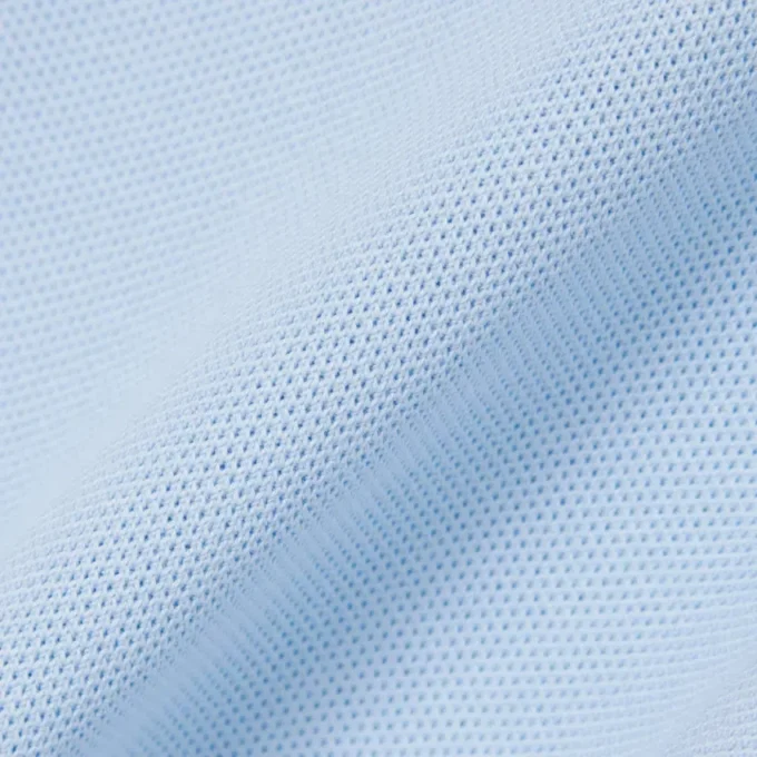 Tuta con colletto polo in piqué elasticizzato Tuta con colletto polo in piqué elasticizzato